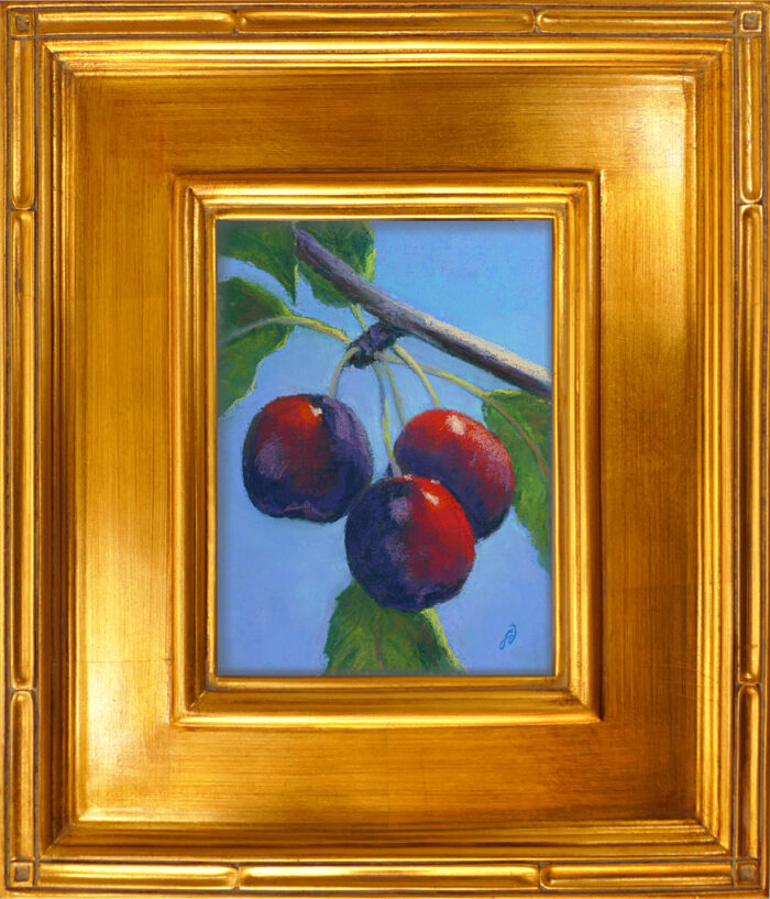 Pastel painting of cherries in gold frame
