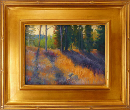 Pastel painting of Crane Mountain with sunlight streaming through the trees framed in gold leaf.