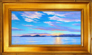 Photo of a painting of a Flathead Lake sunset with frame.
