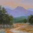 Photo of a pastel painting of East Glacier looking west into the orange sunset.