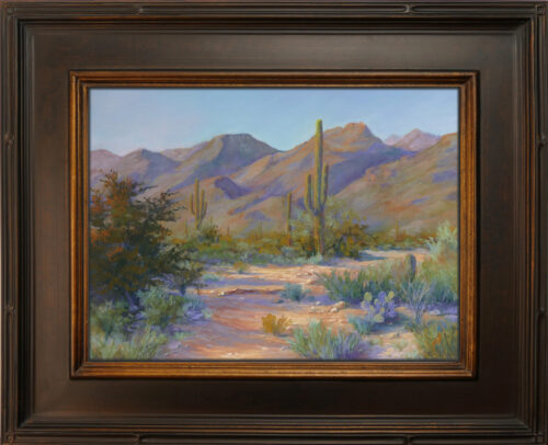 Photo of a pastel painting of a desert wash landscape in Sabino Canyon.