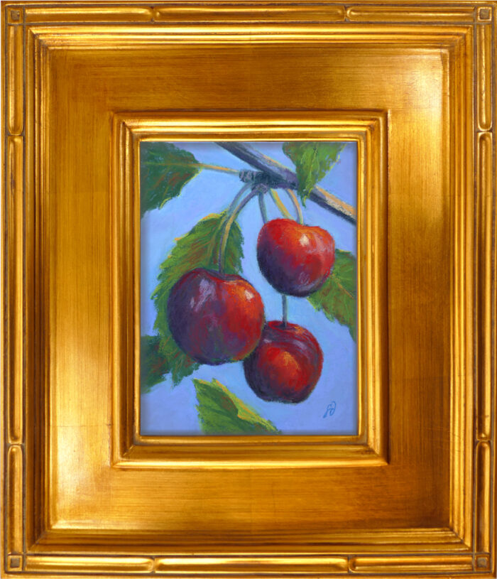 Photo of a pastel painting of Flathead Lake cherries with gold frame.
