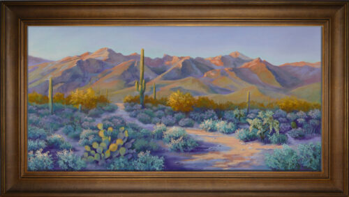 A pastel painting of a path in the desert landscape of Sabino Canyon in Tucson with brown frame.