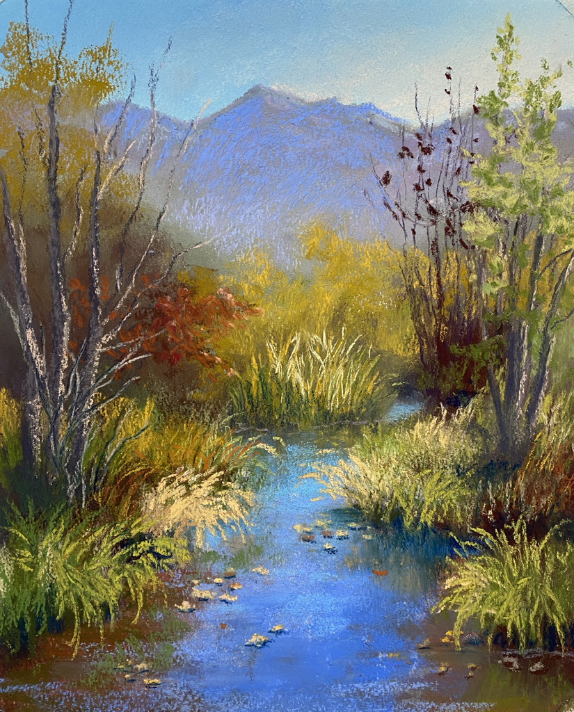 Photo of a pastel painting of a pond and autumn color.