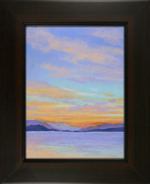 Photo of a pastel painting of a sunset over Flathead Lake with frame.