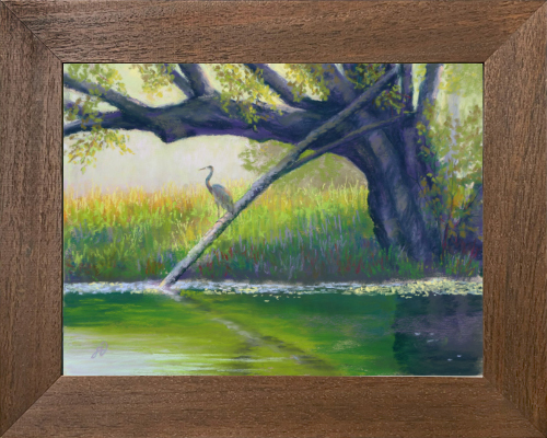 Photo of a pastel painting of a Great Blue Heron perched over a river with brown frame.