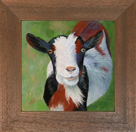 Photo of a pastel painting of a sweet goat. with brown frame.