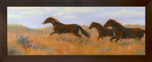 Photo of a pastel painting of horses running with brown frame.