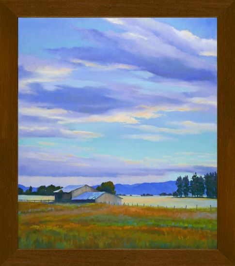 Photo of a pastel painting of a barn in the landscape with brown frame.