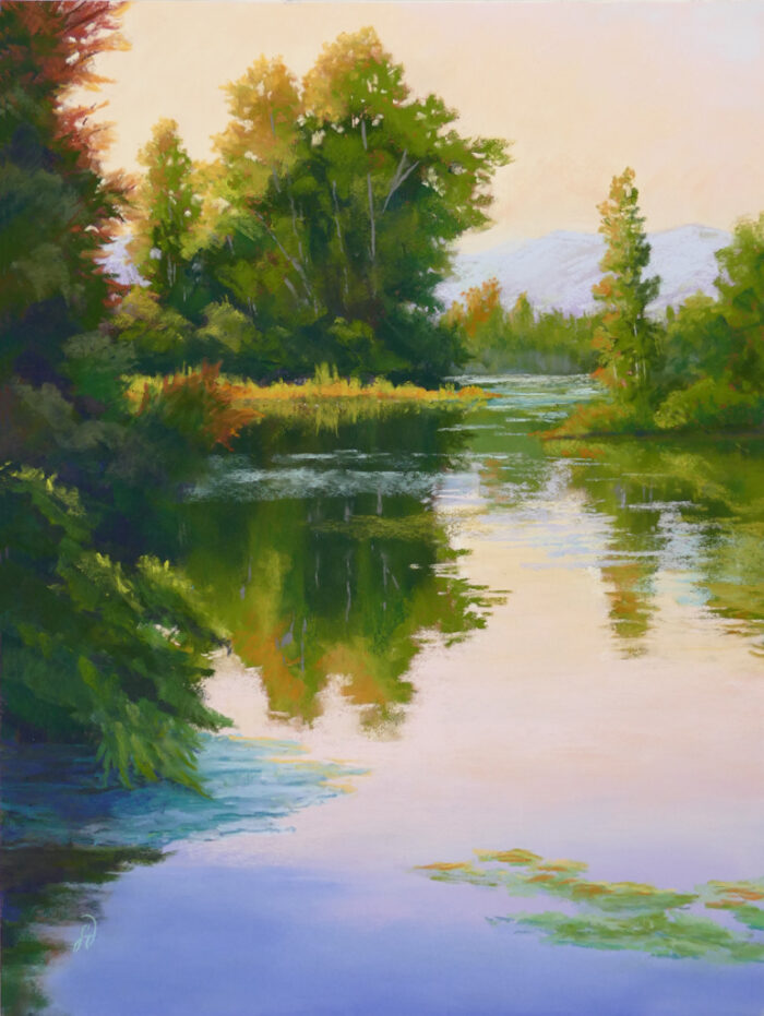 Photo of a pastel painting of water and warm tones on the trees behind.