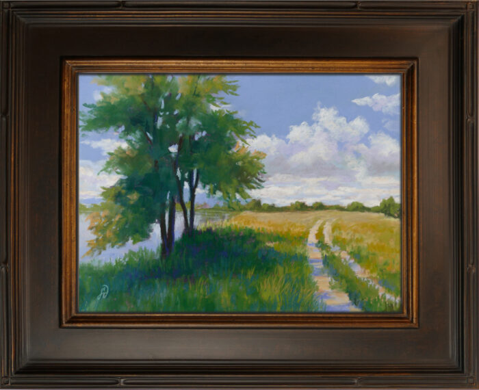 Photo of a framed pastel painting of a trail and tree shadow.